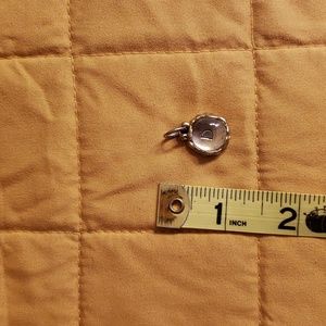 Waxing Poetic D behind glass bubble charm